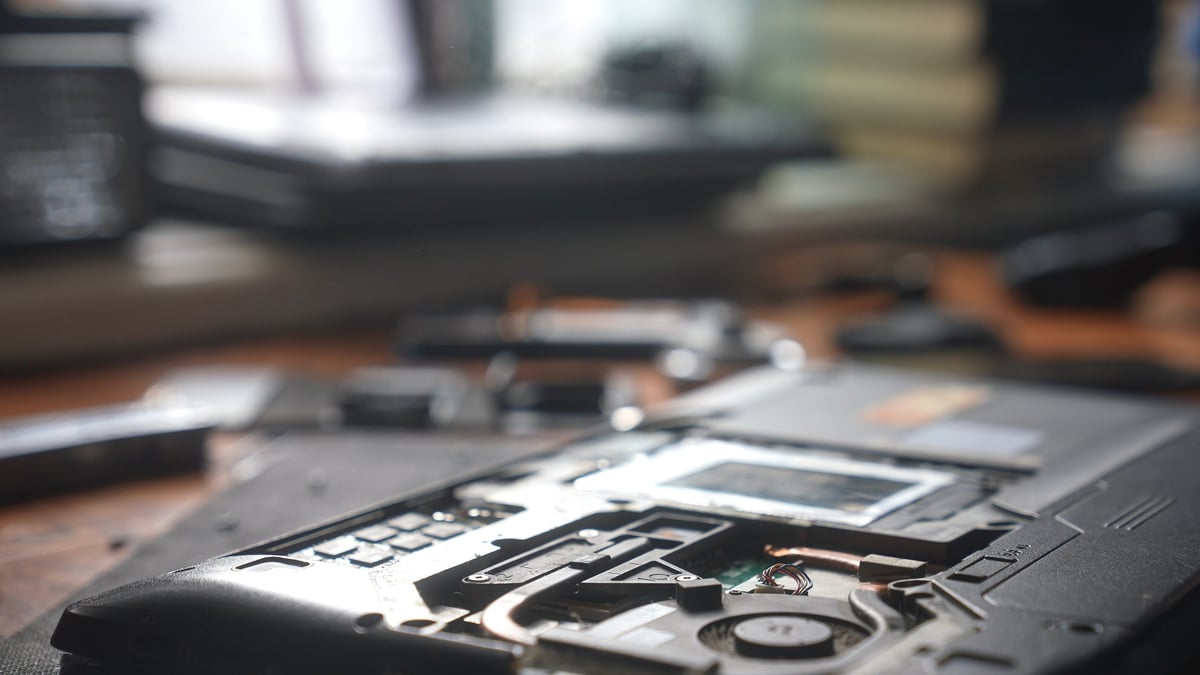 Clean laptop internal components after professional repair and deep cleaning service